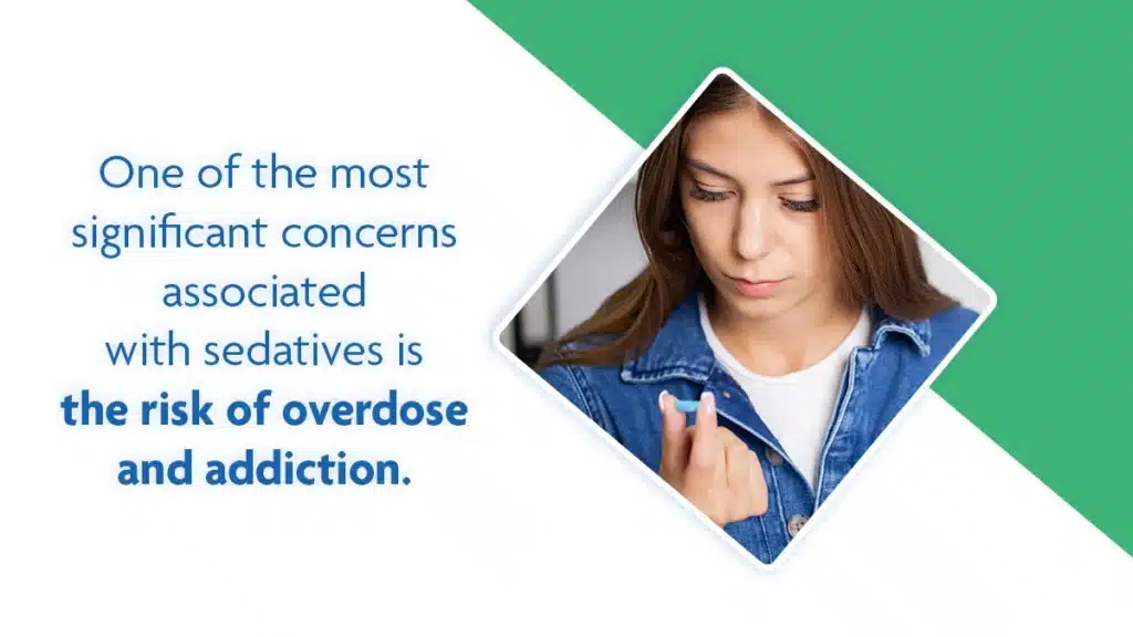 Teenager holding a blue pill between her fingers. One concern associated with sedatives is the risk of overdose and addiction.
